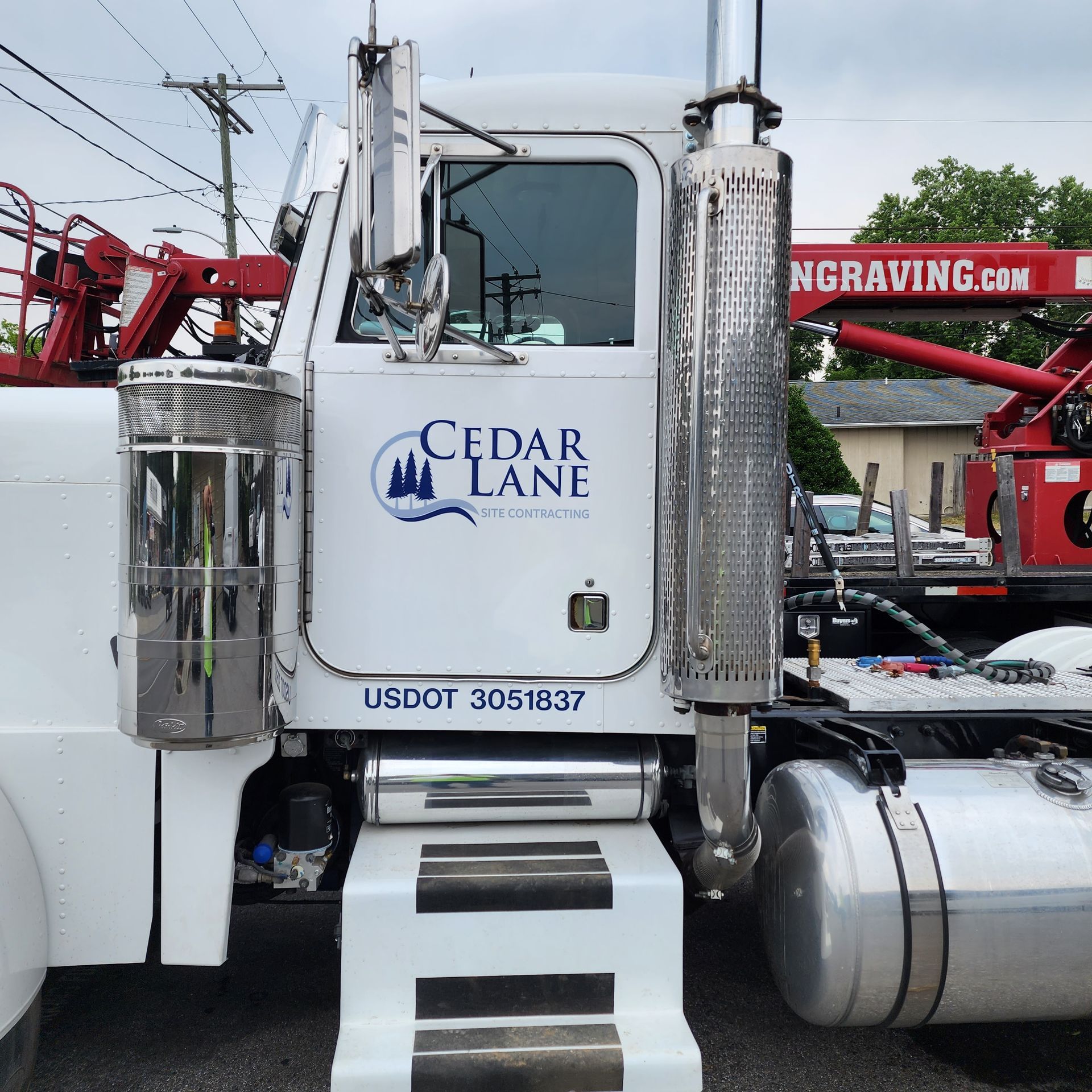 A cedar lane truck is parked in a parking lot