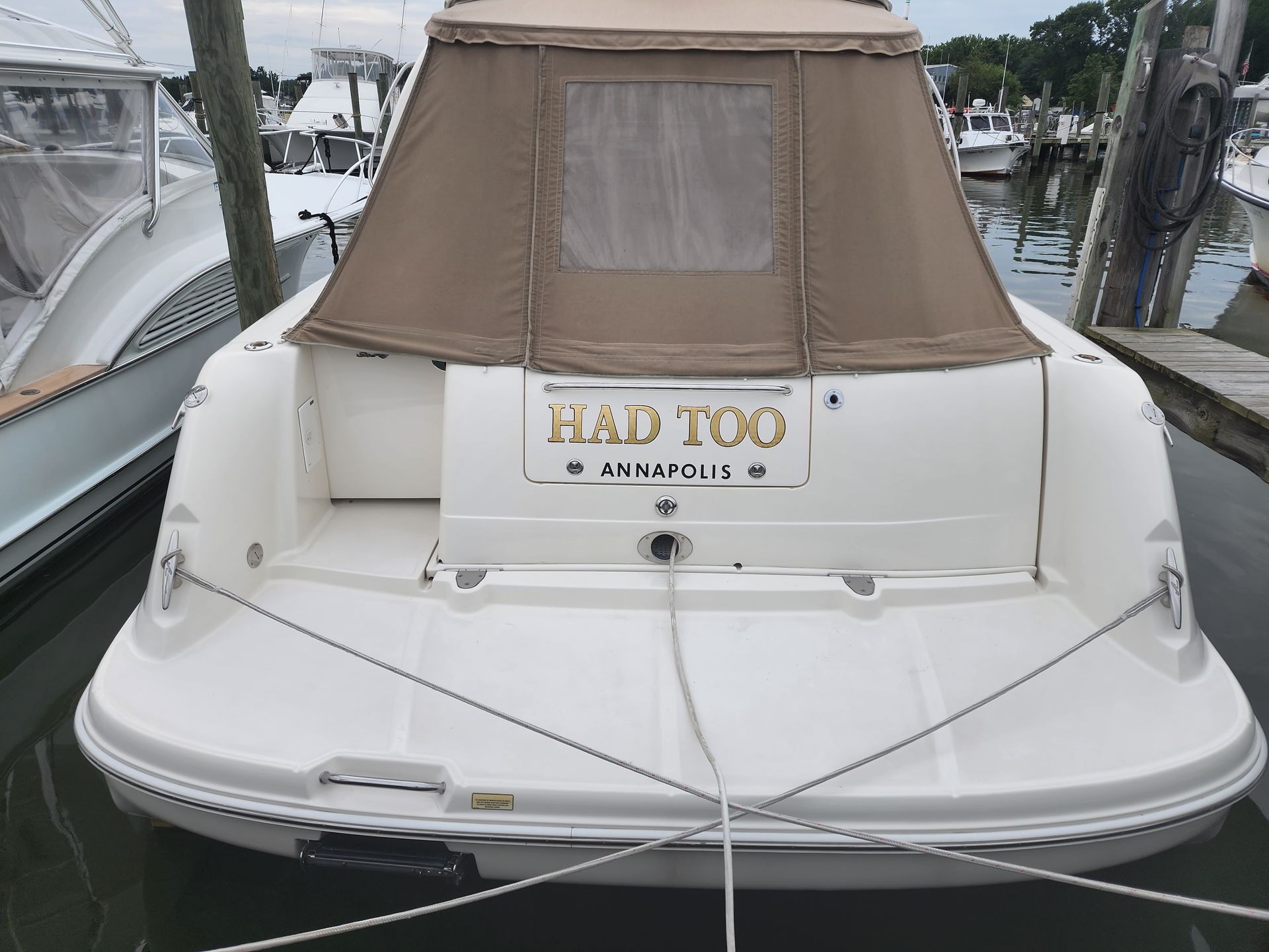 A white boat with a license plate that says had too
