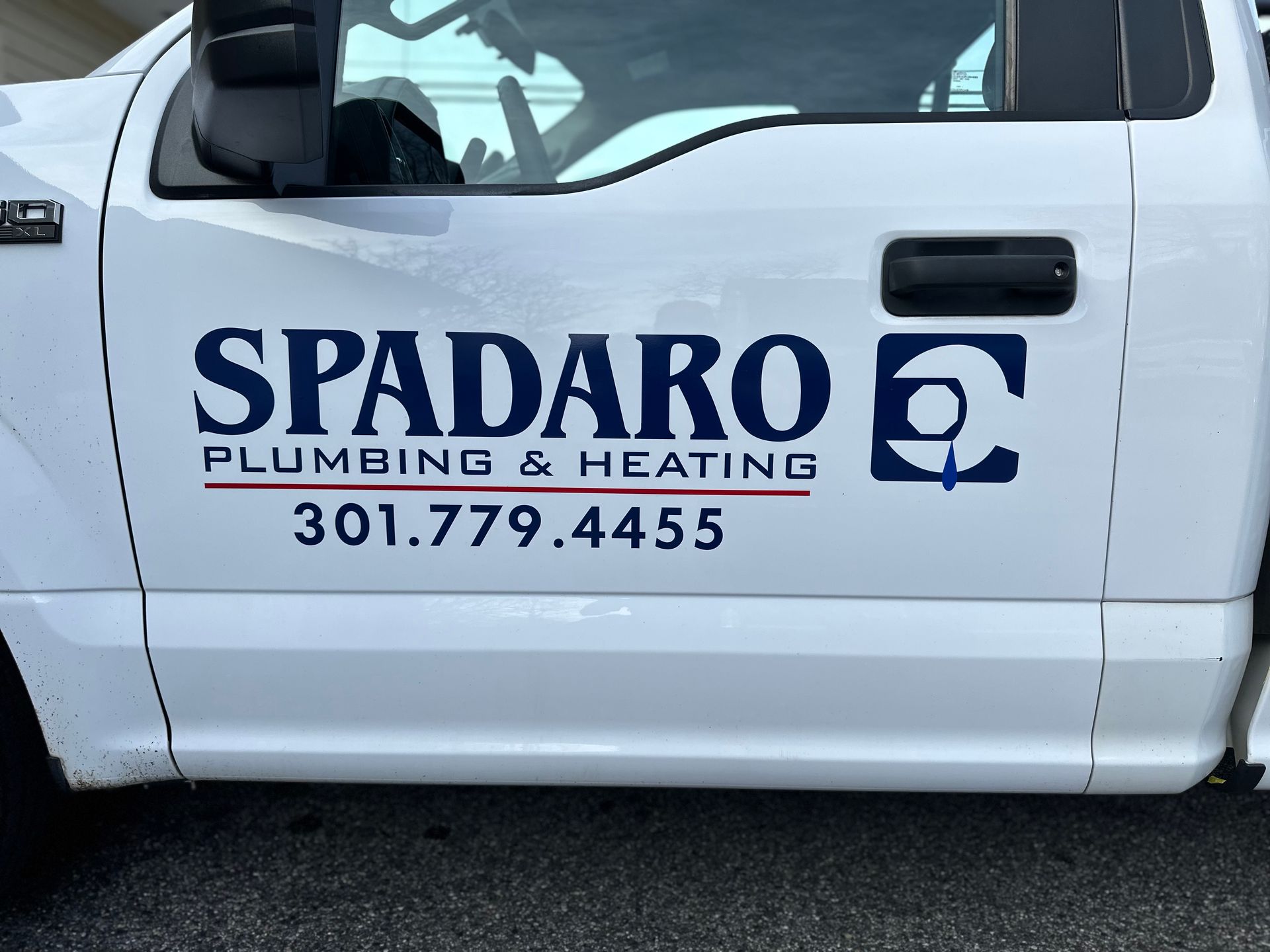 A white truck with spadaro plumbing and heating written on the side