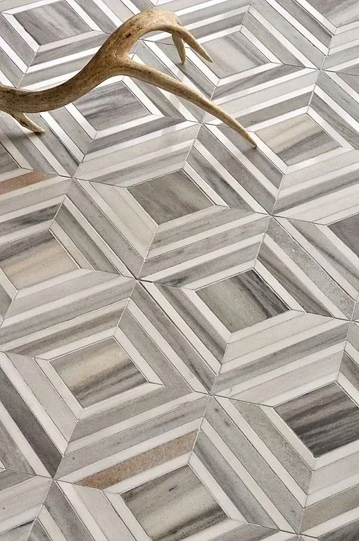 Geometric marble floor tile pattern with antler.