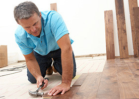 Man repairing a floor