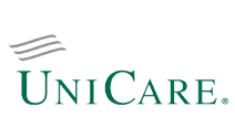 A green and white logo for a company called unicare.