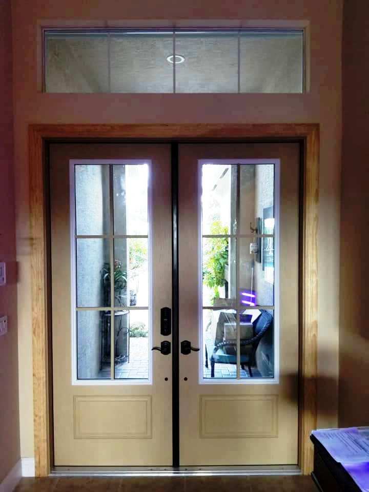 A door with a reflection of a chair in it