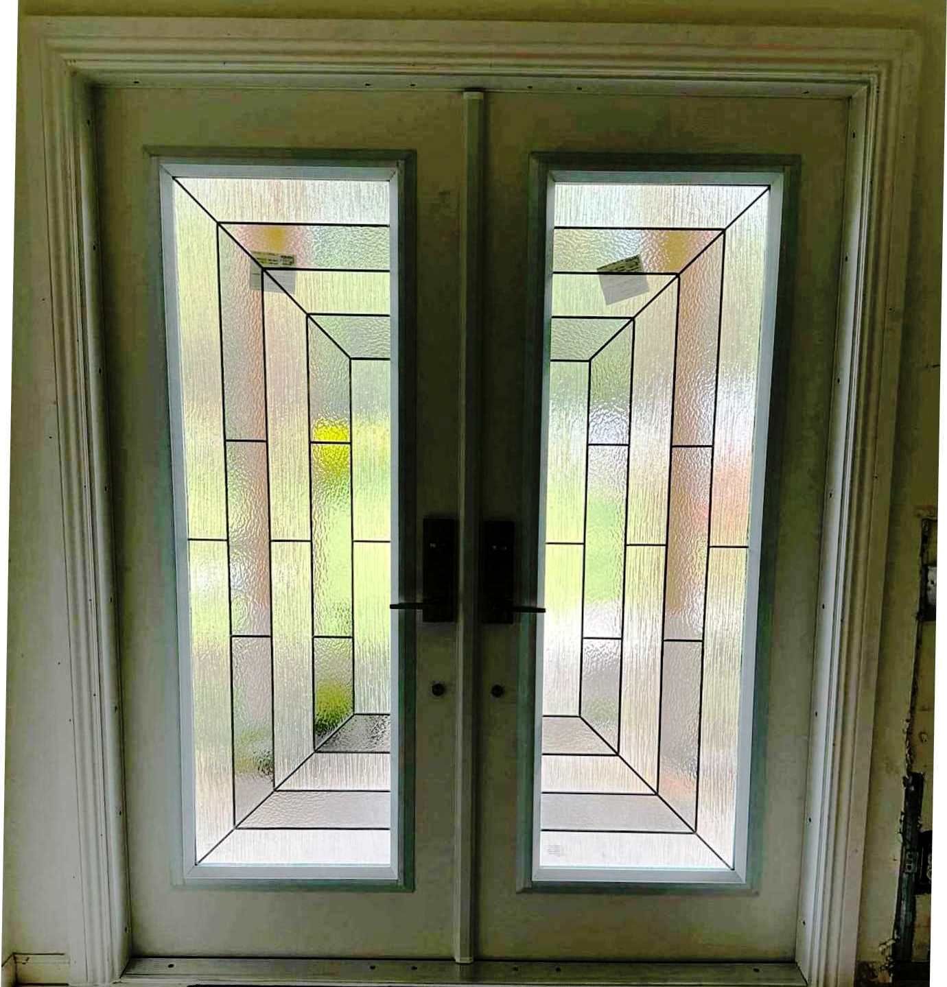 A pair of stained glass doors with a stained glass design