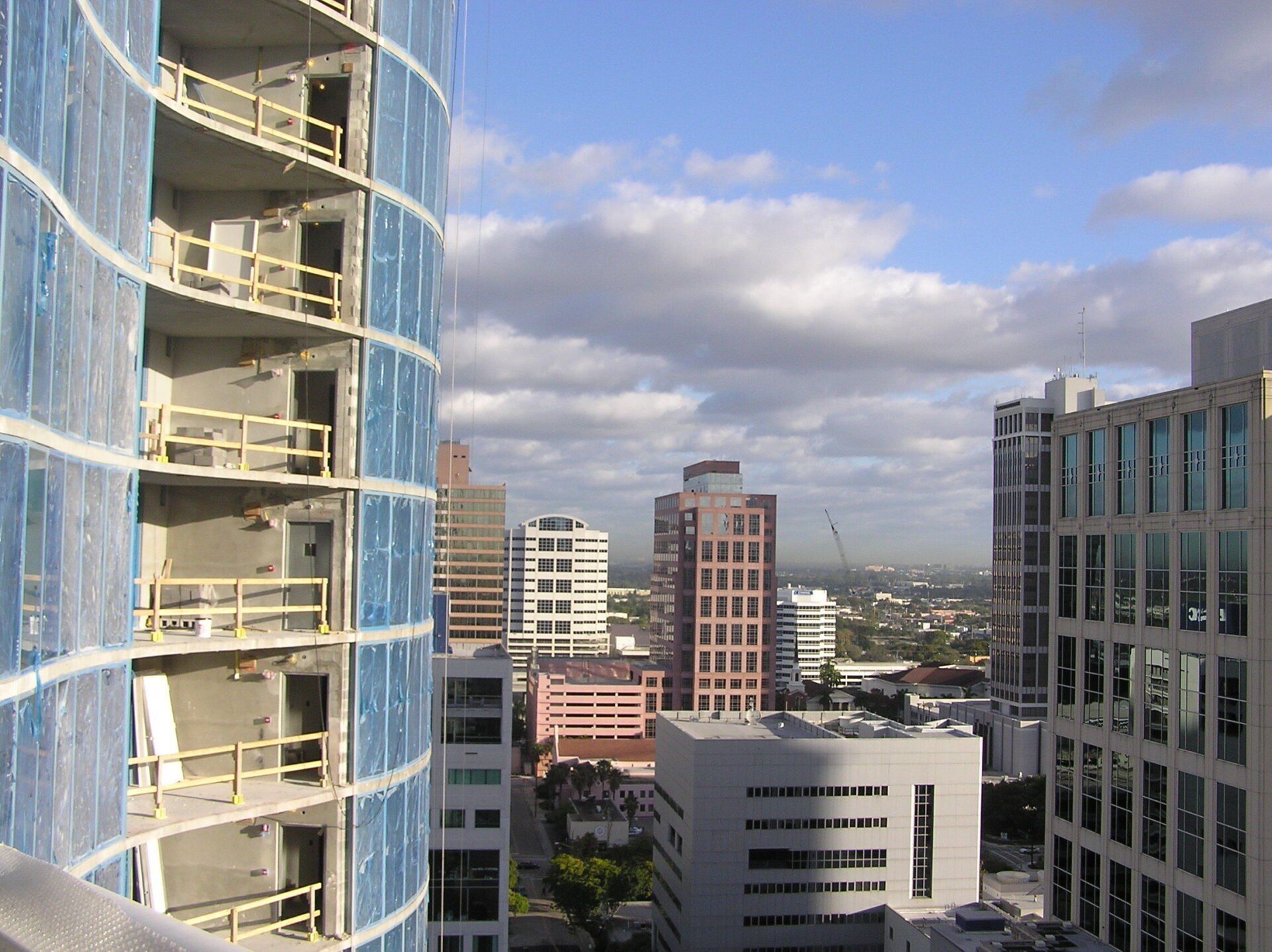 A city skyline with a blue building in the foreground