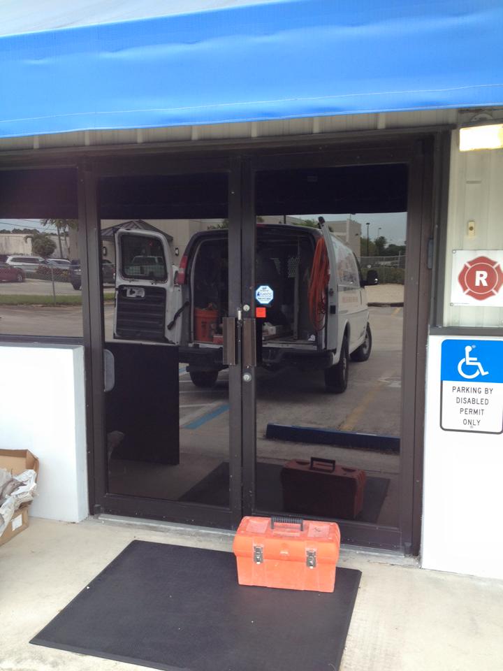 A van is parked in the doorway of a building