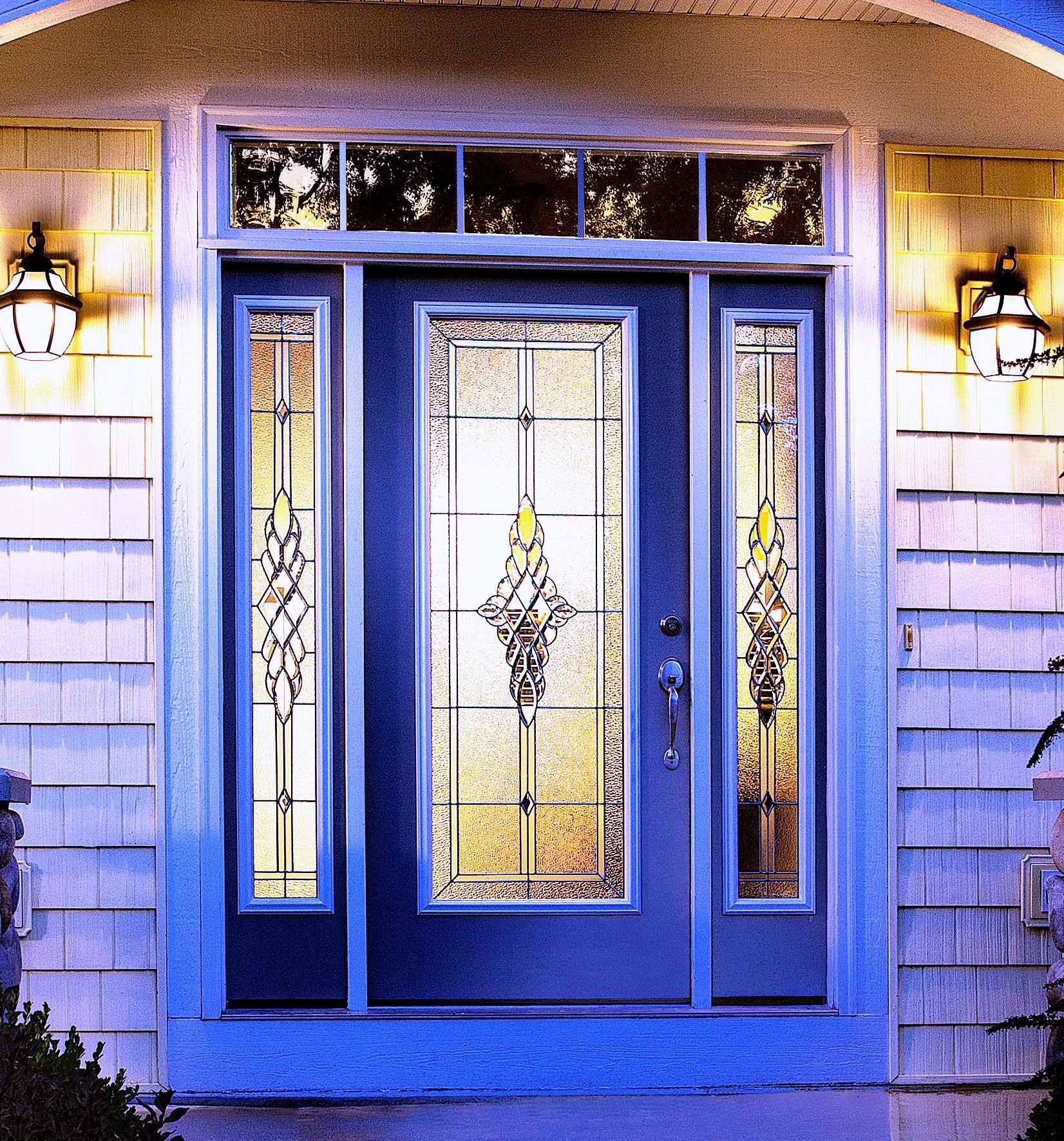 The front door of a house has a stained glass design on it