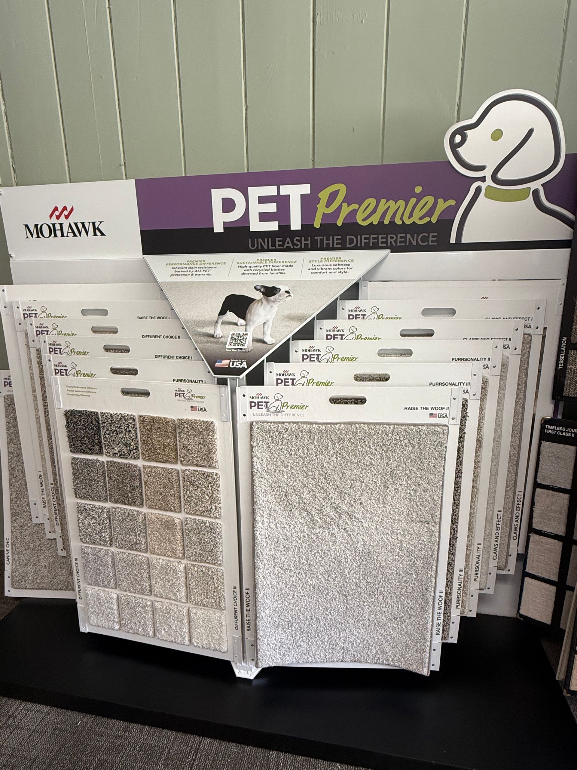 PET Premier sample display with white and gray textured panels on a black stand