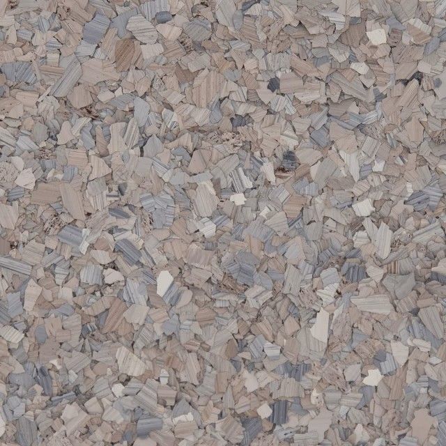 Close-up view of decorative, multi-colored vinyl paint chips in shades of tan, gray, and white for flooring applications.