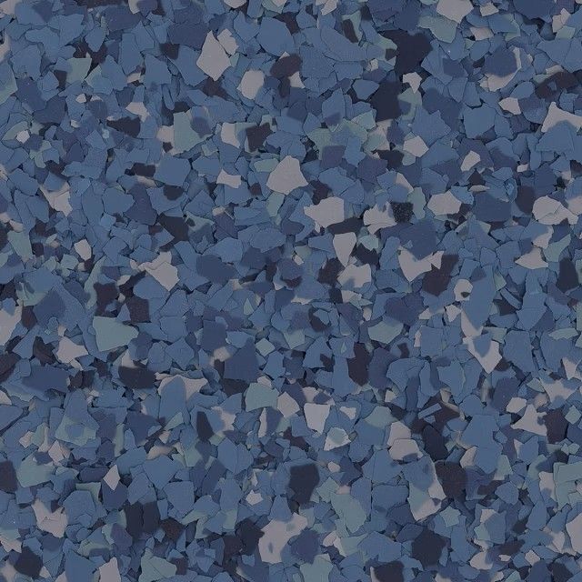 A seamless texture pattern of scattered blue, gray, and dark navy vinyl paint chips for flooring.