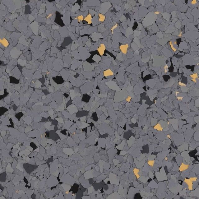 A textured floor coating featuring a mix of gray, black, and tan decorative vinyl flakes.