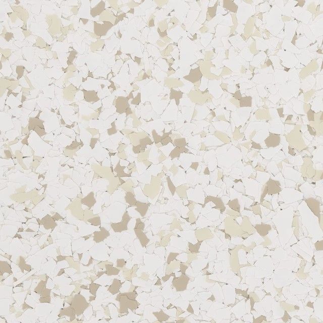 A close-up view of a floor covering with a speckled, mosaic pattern of off-white and light beige vinyl flakes.
