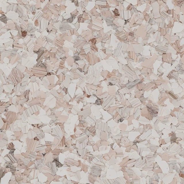 A speckled surface pattern featuring small, irregular chips in shades of white, beige, and soft gray.