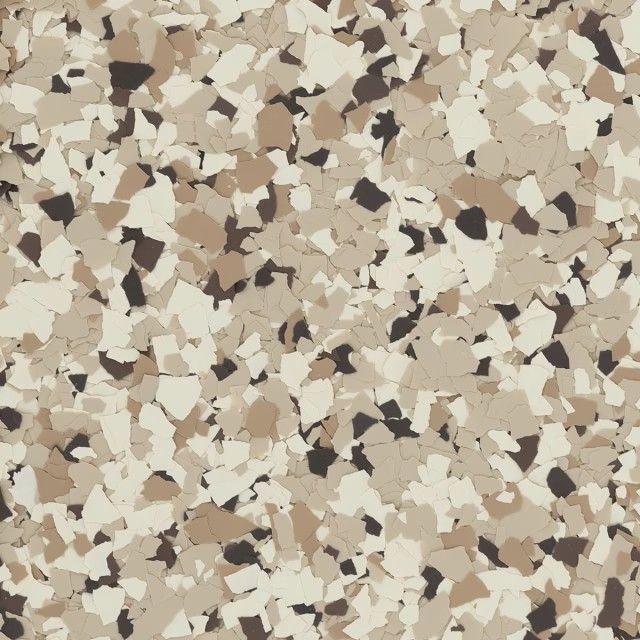 A pattern of multicolored paint flakes in shades of tan, cream, white, and dark brown.