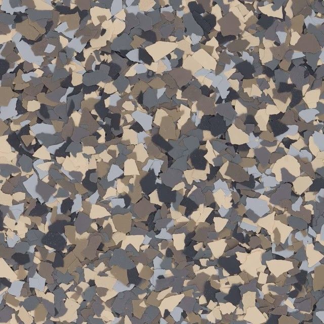 Multi-colored vinyl paint chips in shades of tan, dark brown, and light blue, used for decorative concrete flooring.