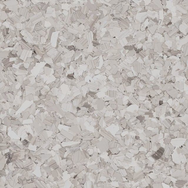 A close-up of a speckled floor texture featuring a mix of light gray, beige, and white vinyl chips.
