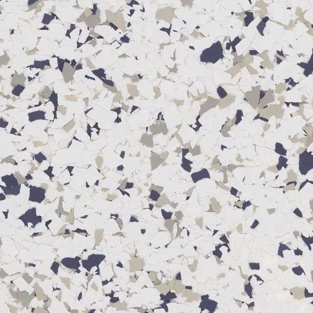 A texture pattern of white flooring with speckled chips in shades of dark blue and light gray.