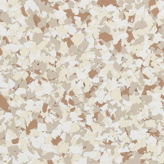 A close-up view of epoxy flooring decorative flakes in shades of white, beige, and tan.