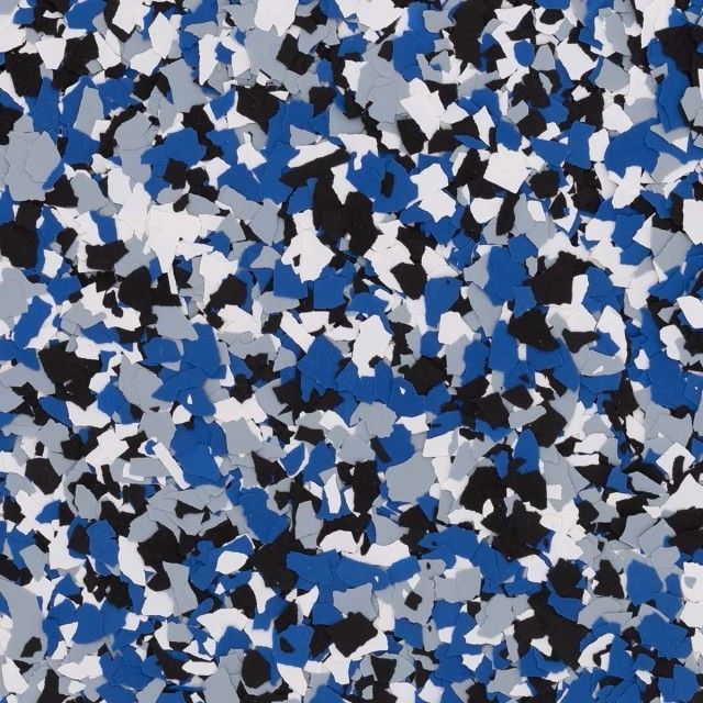 A seamless texture of small, irregular flecks in shades of royal blue, white, light gray, and black.