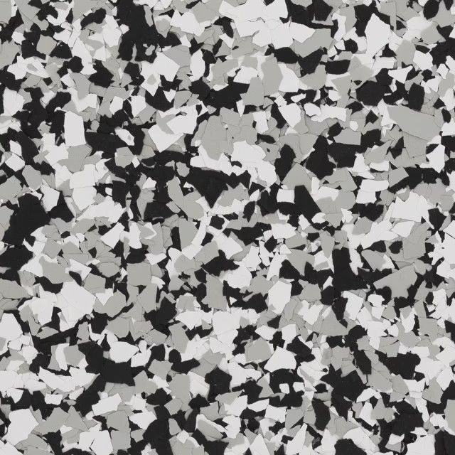 A seamless background pattern of irregular, overlapping black, white, and gray geometric paint chips.