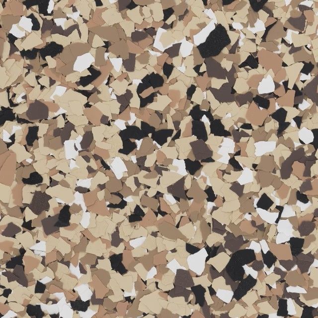 A close-up of multi-colored vinyl floor flakes in shades of beige, tan, dark brown, black, and white.