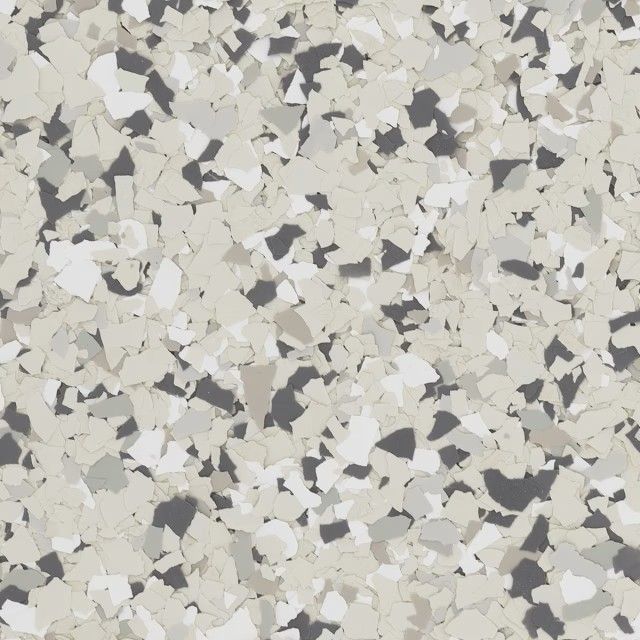 A speckled pattern of vinyl flooring chips in shades of cream, light gray, dark gray, and white.