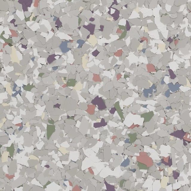 A speckled floor texture with gray, white, purple, green, blue, and reddish-brown vinyl flakes.