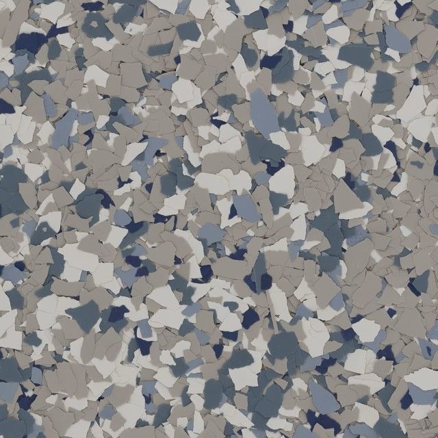 A decorative epoxy floor texture featuring a dense mix of beige, light gray, dark gray, and navy blue flecks.