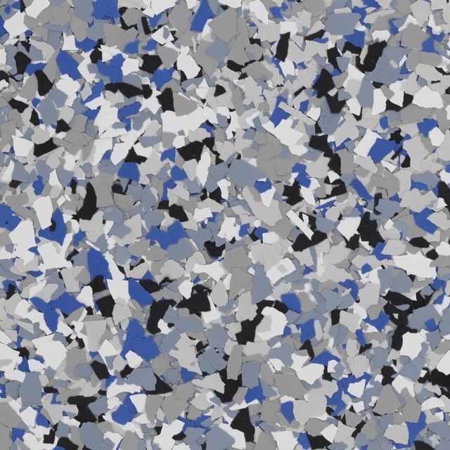 A close-up of a decorative flooring finish featuring a mix of blue, black, gray, and white vinyl color chips.