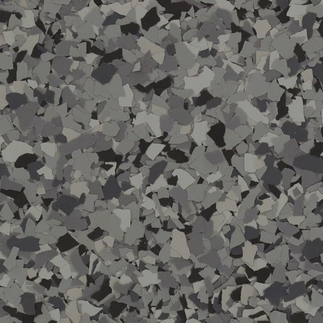 A decorative epoxy floor coating featuring a dense, randomized pattern of gray, dark gray, and black vinyl flakes.