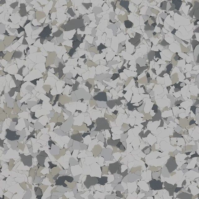 A texture of gray, white, and tan paint flakes scattered across a surface, often used for epoxy flooring.