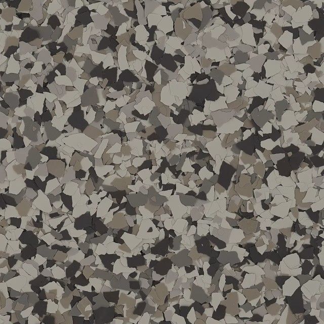 A close-up of a decorative flooring finish featuring a random, speckled pattern of black, grey, and white paint chips.