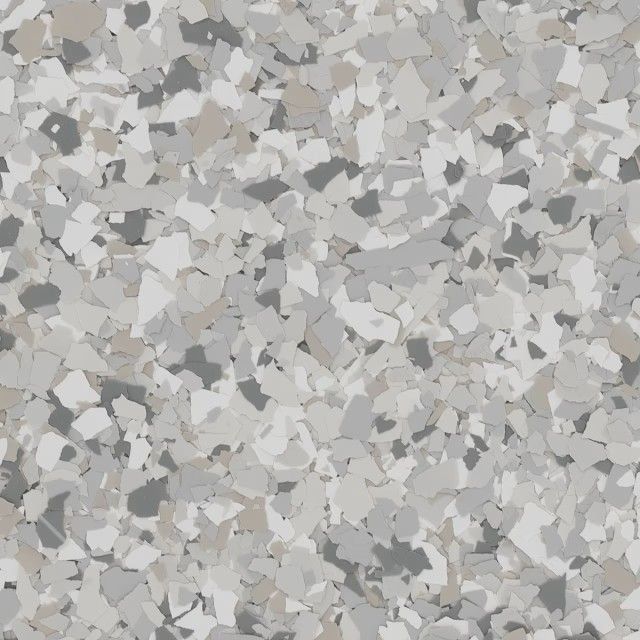 A close-up of a speckled floor coating with a mix of light gray, dark gray, white, and beige vinyl chips.