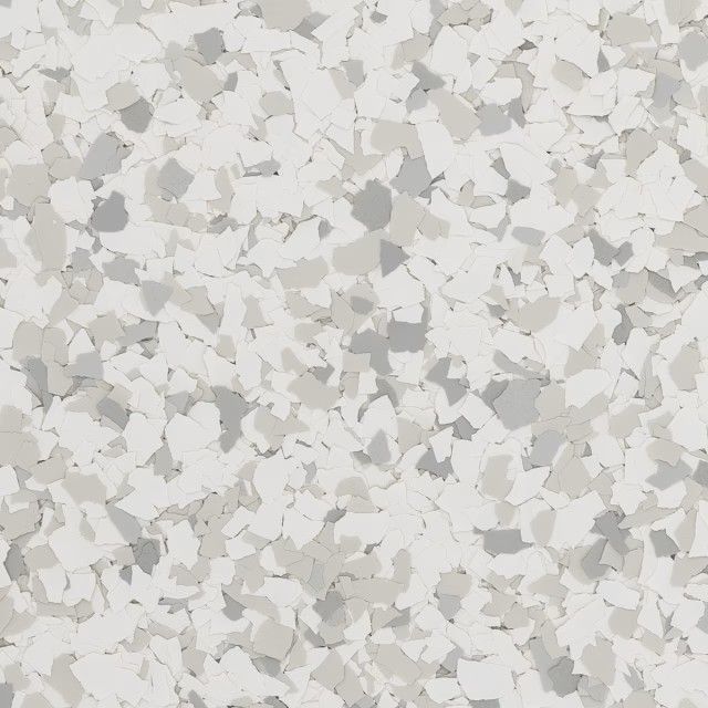 A decorative flooring surface featuring a mix of white, light gray, and beige flakes in a granite-like pattern.