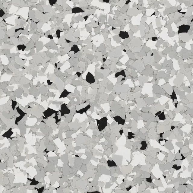 A surface texture of scattered, multi-sized vinyl flakes in shades of black, white, and varying gray tones.