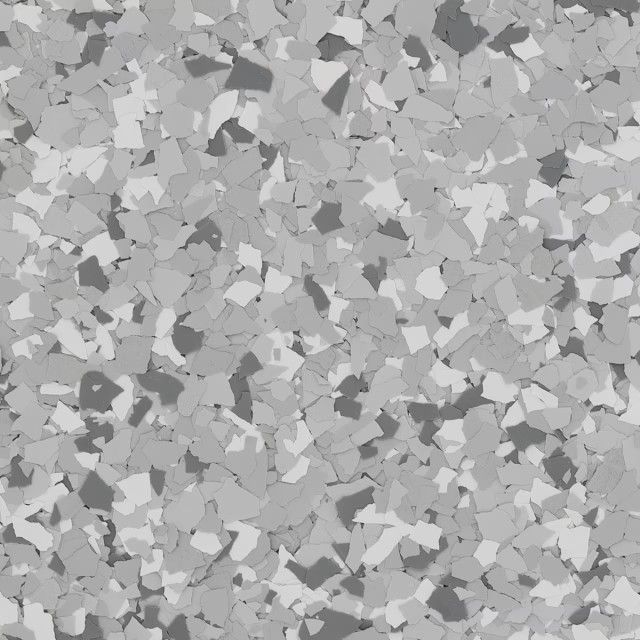 A floor surface covered in gray, white, and charcoal-colored paint chips in a speckled, random pattern.
