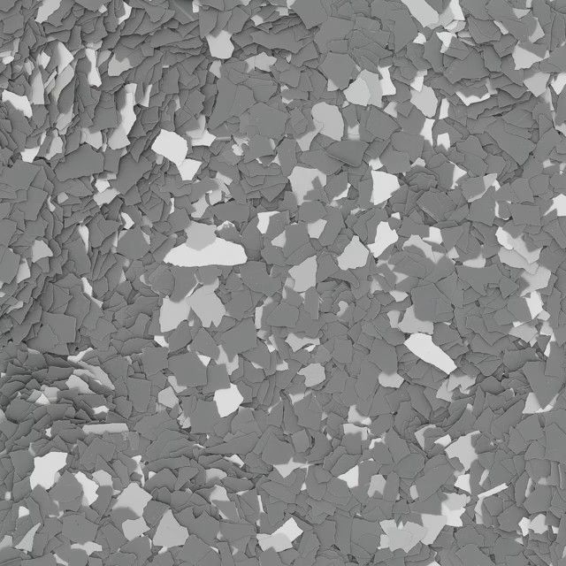 A close-up of monochromatic, gray and white speckled epoxy flooring flakes in an irregular, layered pattern.