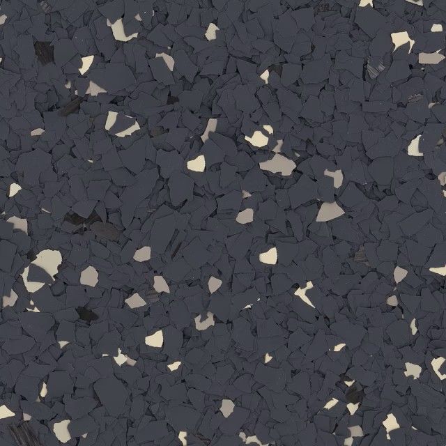 A dark gray epoxy floor texture with scattered small, irregular white and light gray flecks.