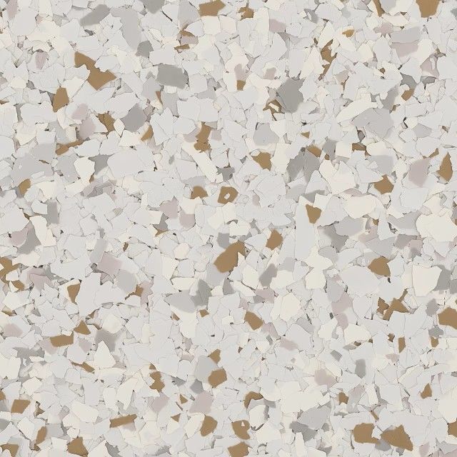 A close-up of decorative vinyl flooring chips in shades of white, light gray, and tan.