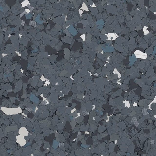 A textured background of gray, dark blue, and white vinyl paint flakes used for garage floor coatings.