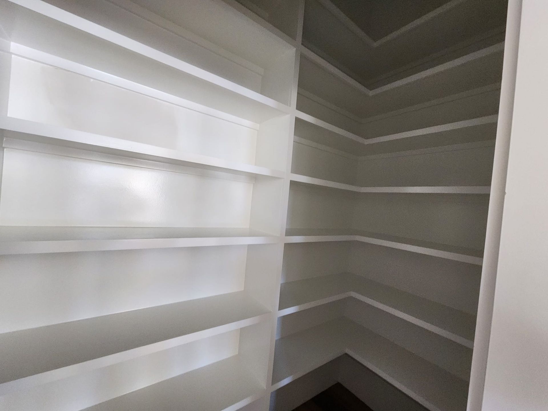 a pantry with a lot of shelves in it