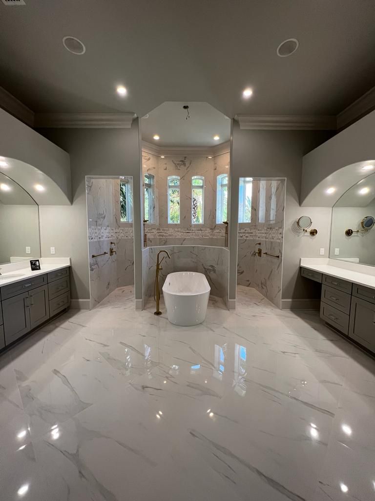 a large bathroom with two sinks and a bathtub