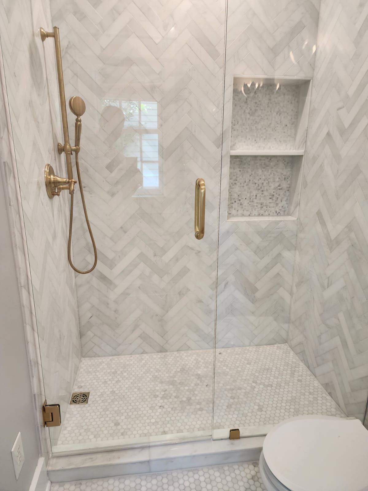 a bathroom with a walk-in shower and a toilet