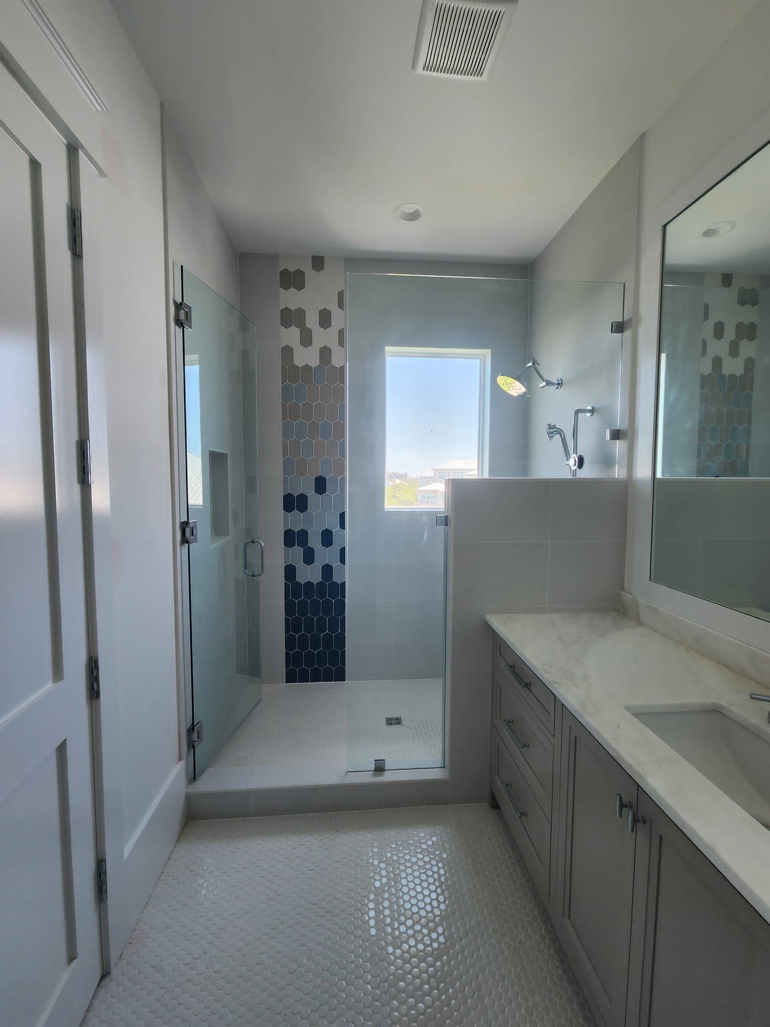 a bathroom with a sink and a walk-in shower