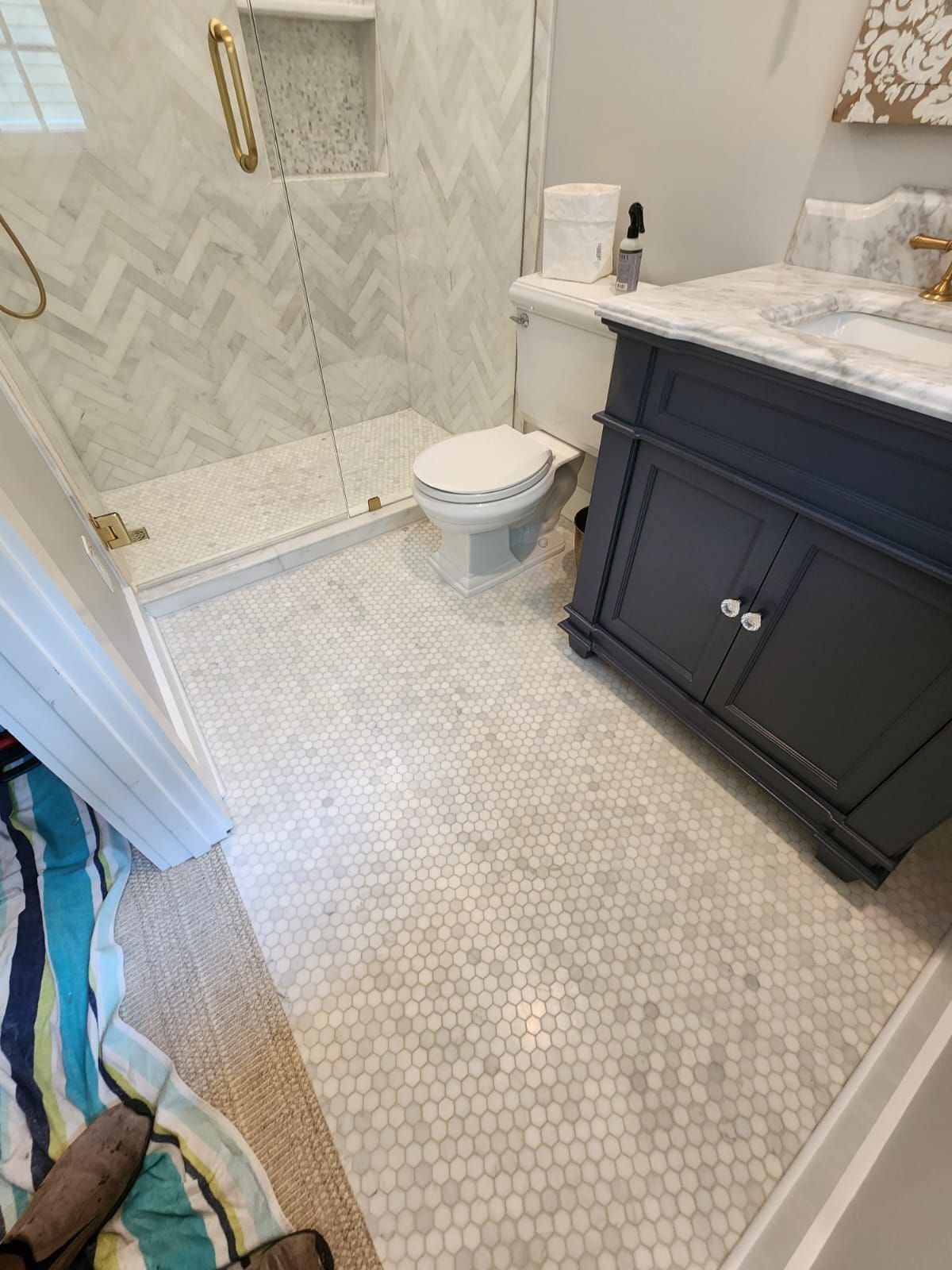 a bathroom with a toilet, sink, and shower