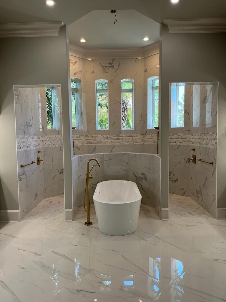 there is a bathtub in the middle of the bathroom