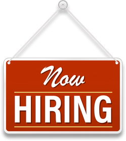 A red sign that says now hiring on it