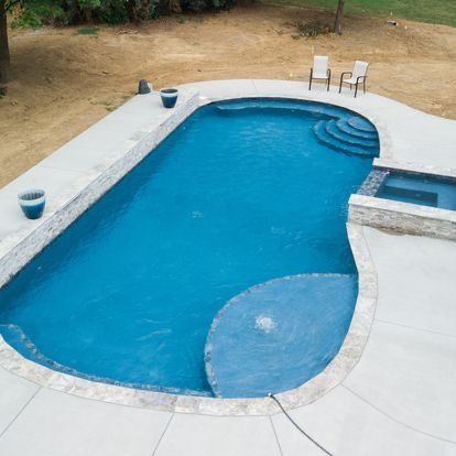 An aerial view of a large blue swimming pool