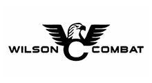 The wilson combat logo is a black and white image of an eagle with wings.