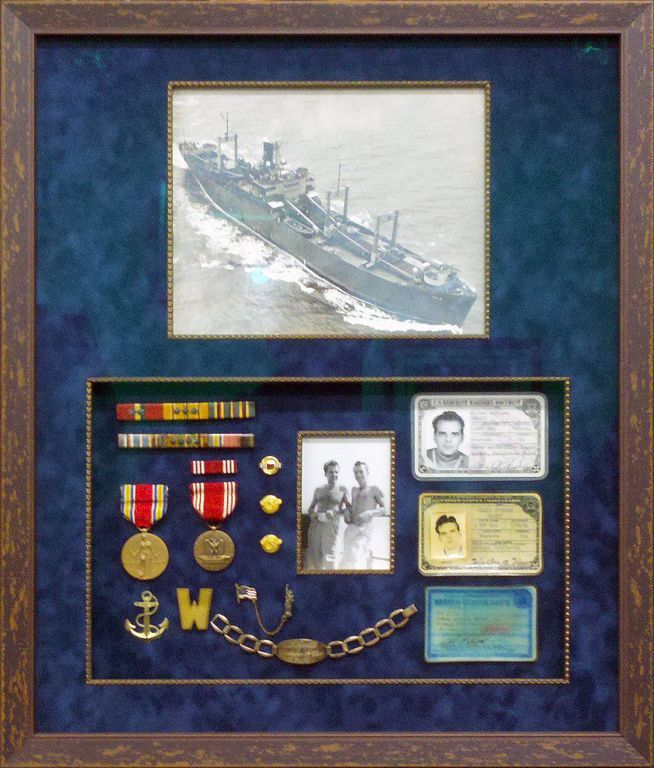 A picture of a ship is surrounded by medals and badges